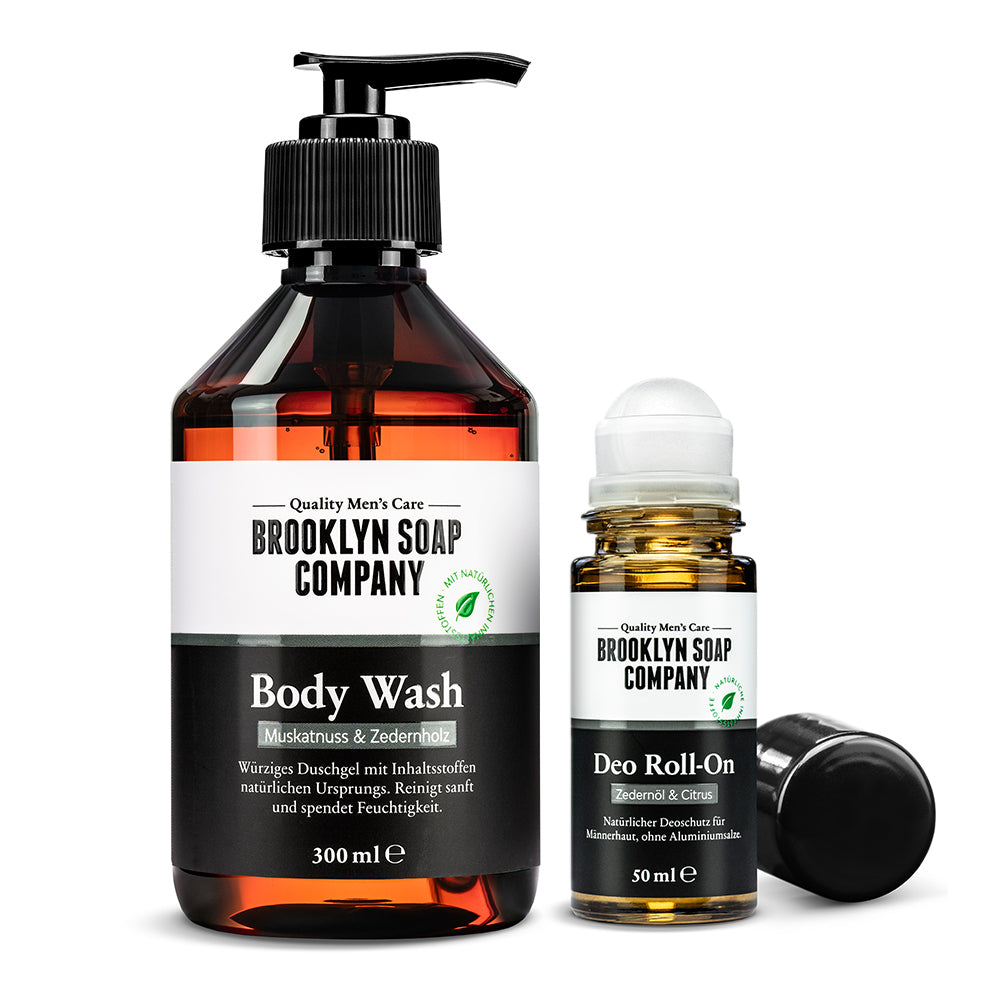 Körperpflegeset mit Duschgel in der Duftrichtung Muskatnuss & Zedernholz und aluminiumfreier Deo Roll-On mit Zedernöl & Citrus von der Brooklyn Soap Company für gepflegte Männer.