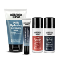 Hochwertiges Gesichtspflege-Set für Männer: Reinigungswaschgel, Augencreme, Tagescreme mit SPF 30 und Nachtcreme von Brooklyn Soap Company für hydratisierte und geschützte Haut.
