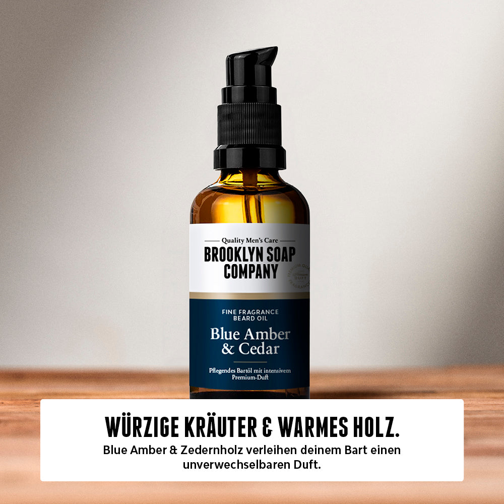 Brooklyn Soap Bartöl Blue Amber & Cedar auf Holzuntergrund – Bartpflege mit würzigem Kräuter- und warmem Zedernholzduft.