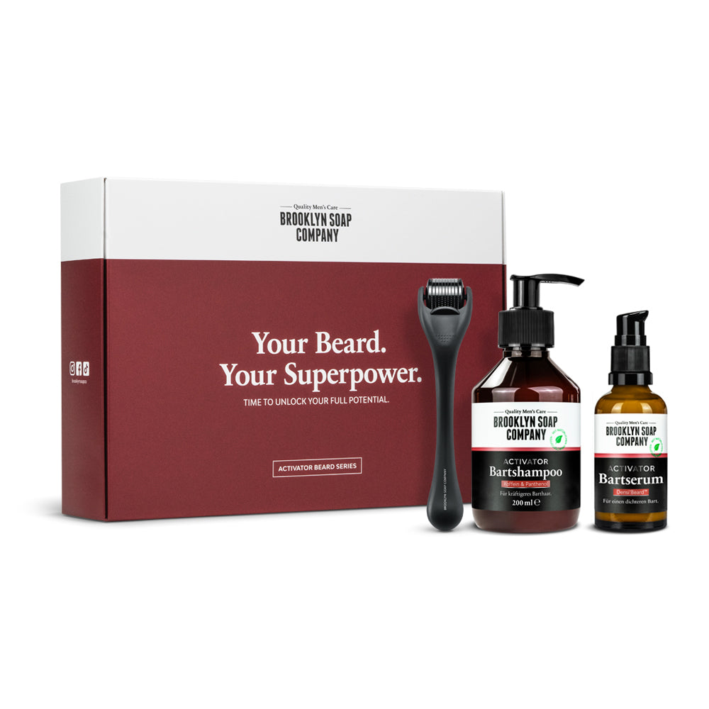 Brooklyn Soap Company beard care set with box, beard roller, shampoo, and serum – labeled “Your Beard. Your Superpower.”
