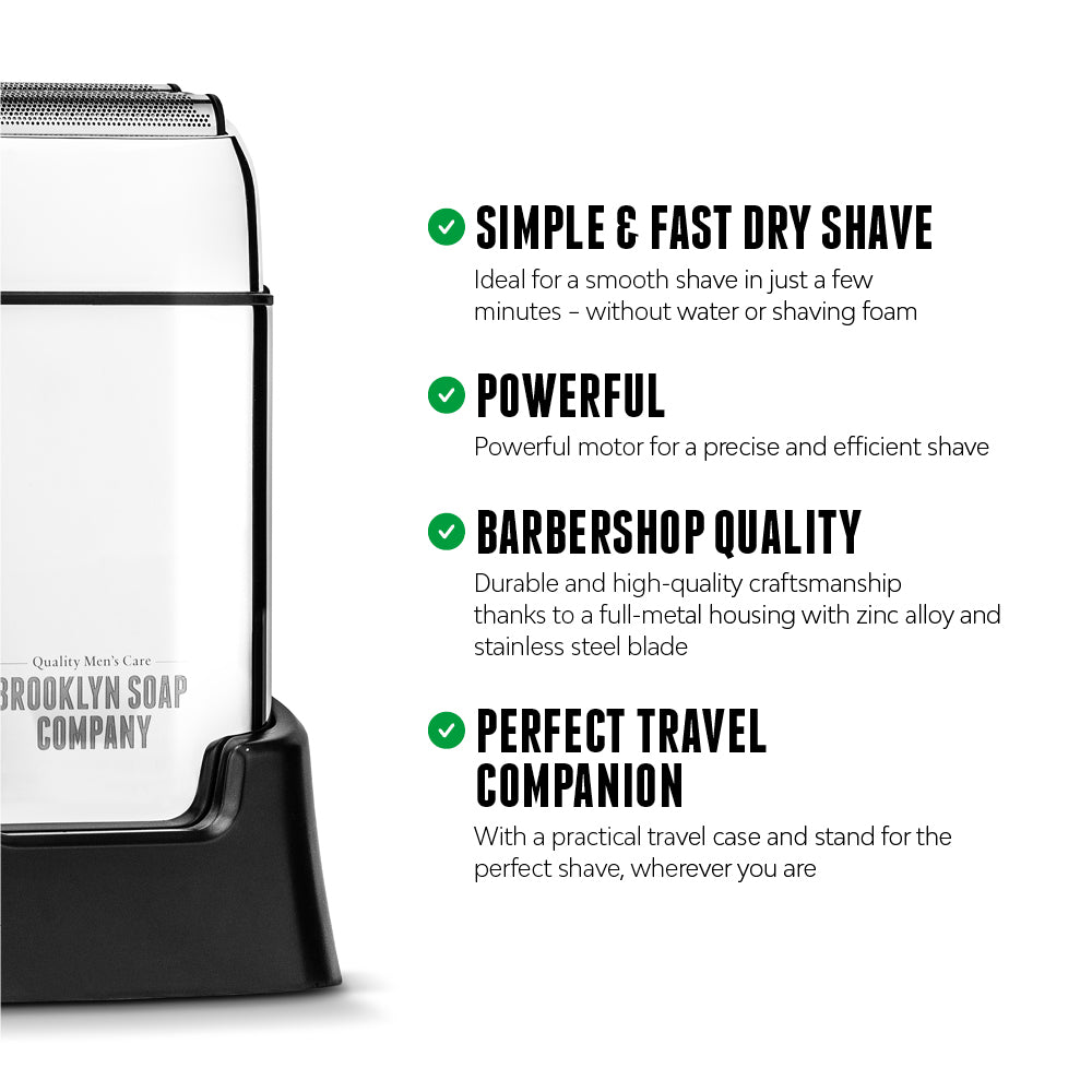 Brooklyn Soap Company electric shaver with features listed: quick and dry shave without water, powerful motor, barbershop-quality metal housing with zinc and stainless steel, and travel-friendly design with case and stand.[INT][EU]