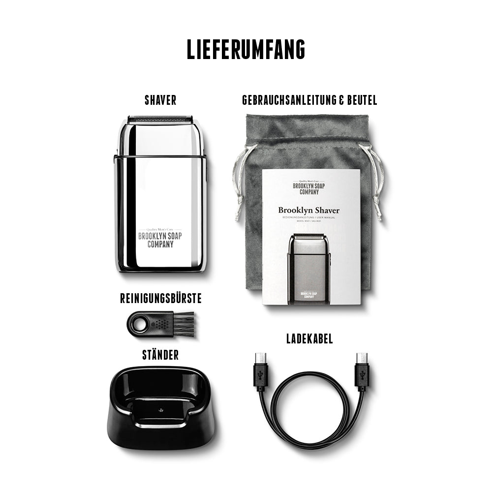 Der Brooklyn Shaver Elektrorasierer kommt mit jeder Menge Zubehör wie z.B. einem Ständer, einem Reise-Etui und einer Reinigungsbürste. [DE] [AT]