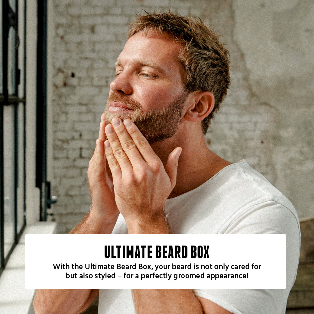 Man with a neatly groomed beard gently touching his face, promoting Brooklyn Soap Company's Ultimate Beard Box for beard care and styling.[INT][EU]