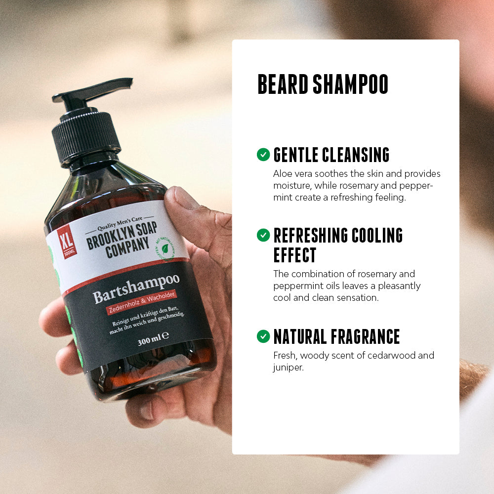 A hand holding Brooklyn Soap Company Beard Shampoo next to product benefits including gentle cleansing, a refreshing cooling effect, and a natural cedarwood and juniper fragrance.[INT][EU]